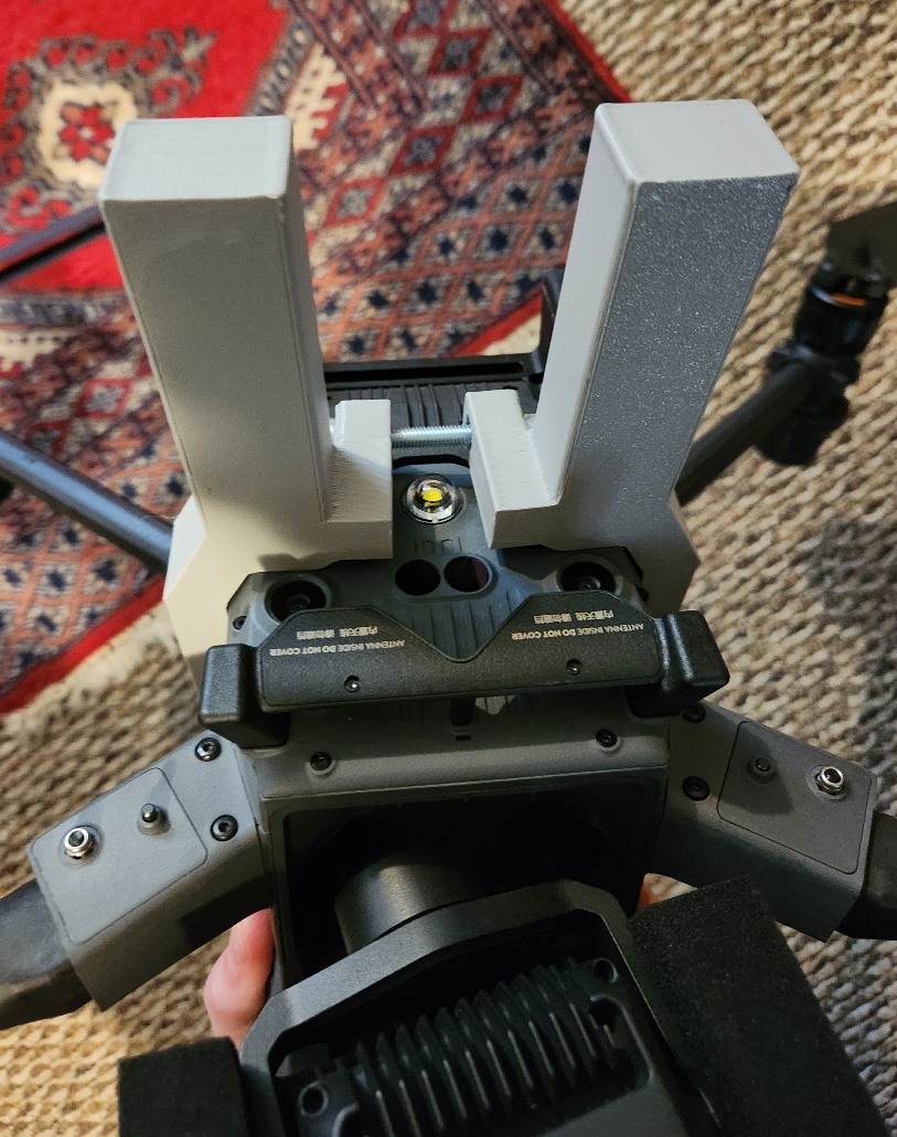 Bottom of drone with catch handle attached