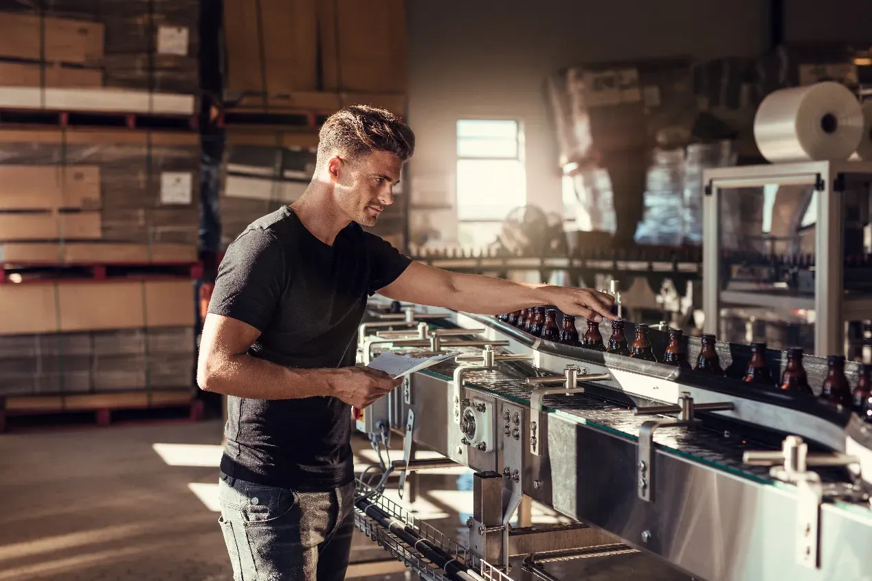 Production Line Man inspecting production